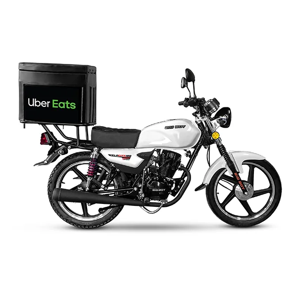 Motorcycle delivery driver navigating city streets with gear